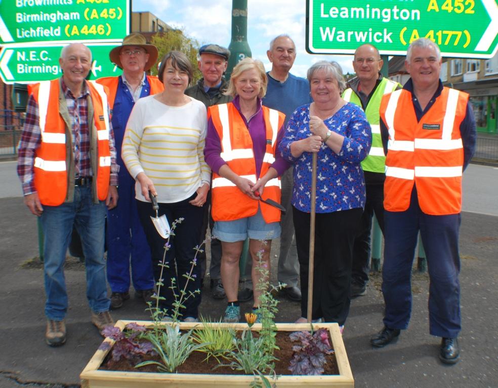 Installing planters on the central Balsall Common roundabout with the residents association.